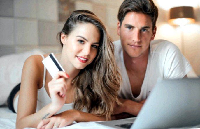 Happy-young-couple-doing-purchase-on-internet-together-at-3767397-768x512.jpg